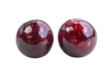 Fototapeta premium Two fresh plums close up view on white background
