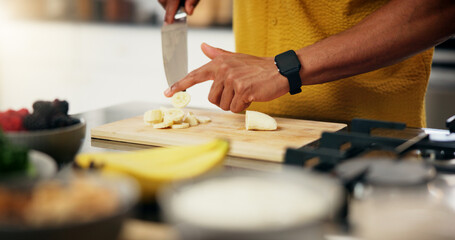 Cooking, hands and cut fruit in kitchen for meal preparation, healthy salad and appetizer recipe. Nutrition, closeup and person with banana ingredients in home for vegetarian snack and organic lunch