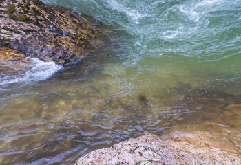 the source of the river in the wild, a walk along the riverbed with a view of the canyon