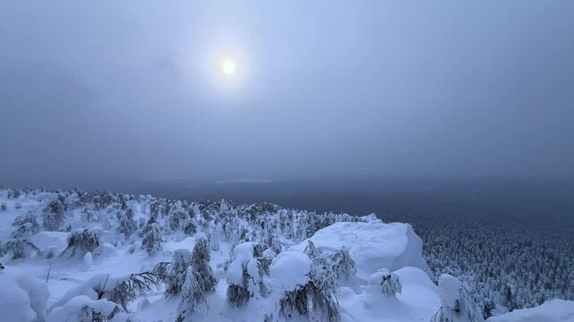View of the white rocks and the winter forest on Mount Polyud. Lappish spruces on Mount Polyud in the Perm region in winter. In winter, there is a lot of snow and frost on the trees in the Urals. 4К