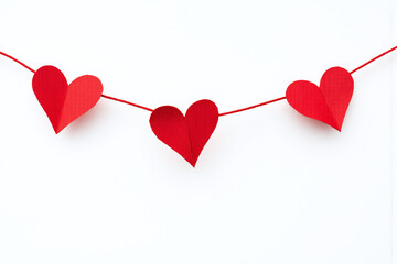 red heart garland on a white background