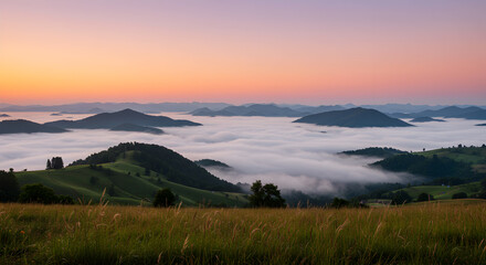 Obraz premium Dreamy dawn landscape with fog-filled valleys and rolling hillside vistas