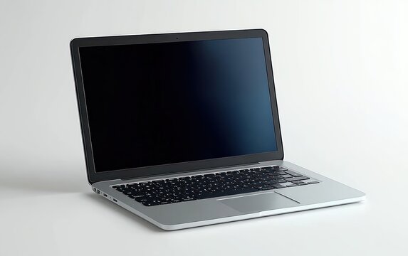 Sleek laptop computer with black screen and silver body placed on white surface showcasing modern design and technology