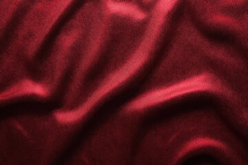 Obraz premium Smooth and soft red fabric with elegant folds and subtle light reflections creating a sense of luxury and warmth