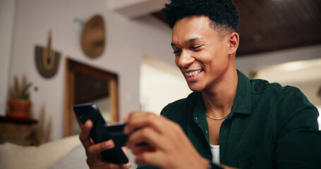 Credit card, phone and scroll with man on sofa for online shopping, digital payment or fintech....