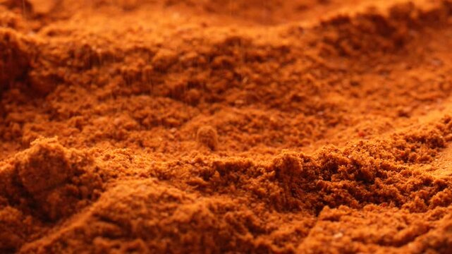 Macro video of turmeric powder kept on rotating disk. Close up of haldi powder.