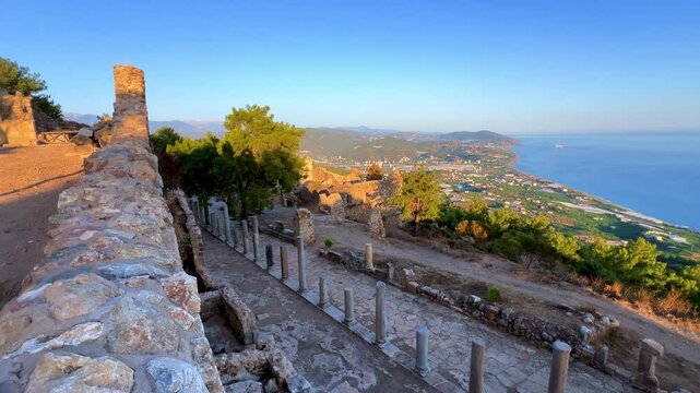 Ruins of the ancient Roman port city of Siedra in Alanya, Antalya, Turkey. The street and ruins of the ancient abandoned ancient city of Siedra on the Mediterranean coast. 4К