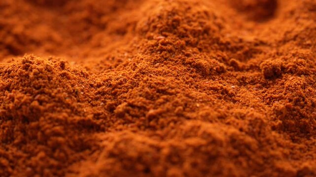 Macro video of red chilli powder kept on rotating disk. Close up of kashmiri chilli powder. 