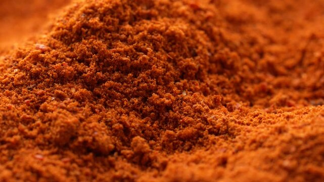 Macro video of red chilli powder kept on rotating disk. Close up of kashmiri chilli powder. 