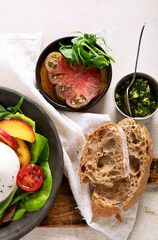 Salad with burrata cheese, lettuce and tomatoes
