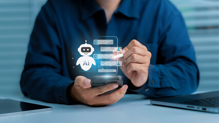 AI chatbot, artificial intelligence. A person uses a smartphone with a holographic AI chatbot...
