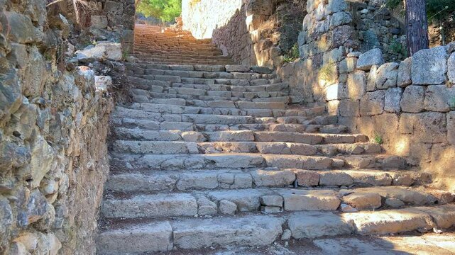 Ruins of the ancient Roman port city of Siedra in Alanya, Antalya, Turkey. The street and ruins of the ancient abandoned ancient city of Siedra on the Mediterranean coast. 4К