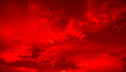 Abstract dark red background. Dramatic red sky. Red sunset with clouds. 