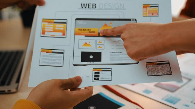 Excellent startup company employee presenting user interface prototype for mobile application or website to smart manager in office. UX UI designer pointing web page icon design and explain. Synergic