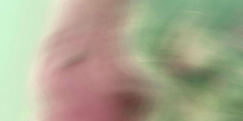 Abstract blurred background with pink and green hues a soft dreamy texture