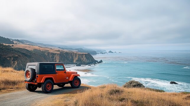 orange off-road vehicle parked on a coastal dirt road overlooking the ocean with rocky cliffs and grassy hills under a cloudy sky - Powered by Adobe