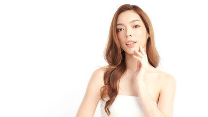Fototapeta premium A beautiful young Asian woman with clean, fresh skin against a white background. Skincare, facial treatment, cosmetology, beauty, and spa. An elegant portrait of an Asian woman.