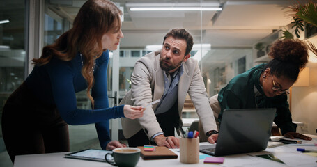 Discussion, meeting or business people planning for teamwork, collaboration or investment at night. Manager, tech or financial advisor in dark office for corporate project, budget or risk management