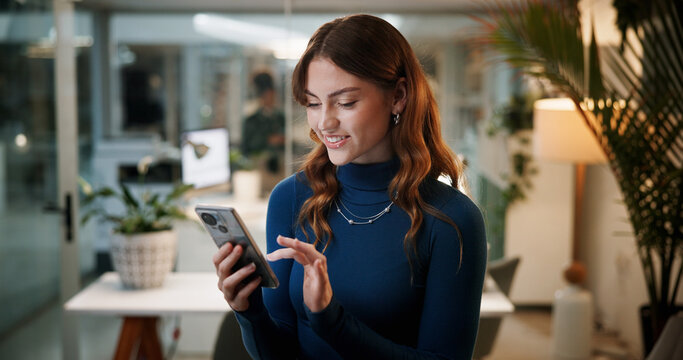 Business woman, cellphone and scroll in office at night for communication, contact or company email access. Female employee, technology and happy with feedback, social media target and deadline - Powered by Adobe