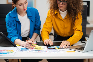 Two caucasian designer meeting concept design ideas at office. © NINENII