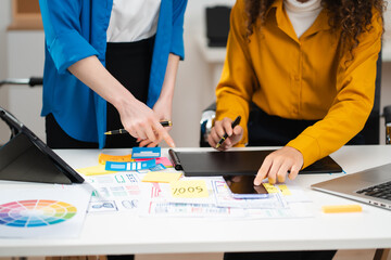 Creative digital development agency. developer team brainstorming on project with laptop, smartphone and digital tablet.