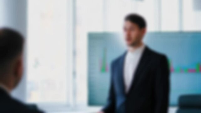 Blurred background of research director illustrating data trends with scatter plot