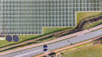 Greenhouse aerial drone view background from above, large industrial greenhouses for growing vegetables, modern plantation glasshouse area, agriculture in the Netherlands