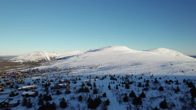 Aerial Drone View of Winter Landscape with Mountains in Trysil Norway - Panning Shot