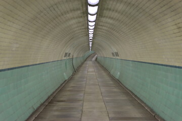 Underground pedestrian and cycle tunnel beneath a river