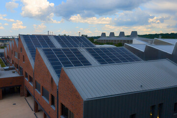 aerial view of solar panel on the roof of the old factory warehouse converted into residential...