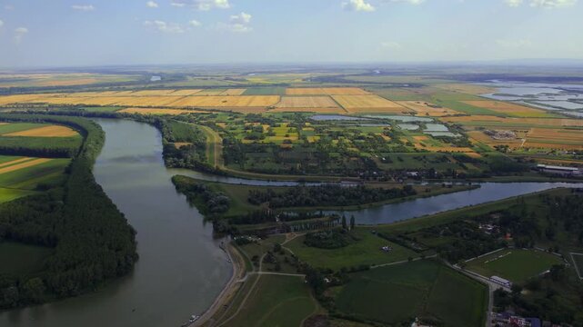 Aerial view of Becej showcasing the rivers, fields, and landscape in a serene environment during the daytime