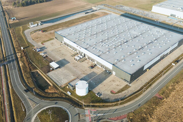 Industrial warehouse complex with trailers and freight
