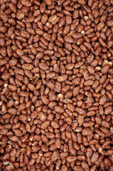 Chocolate flavour crisped rice grain breakfast cereal food detail background