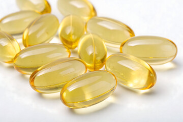 Close-up of Yellow Softgel Capsules on White