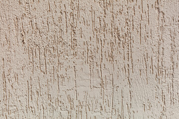 The wall has a textured surface with a pattern of lines