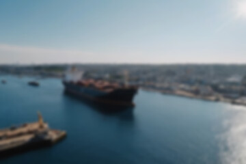 blurry harbor, bright ship harbor, exposed to morning sunlight, large ships are seen docked at the harbor pier, wallpaper, blurry background.