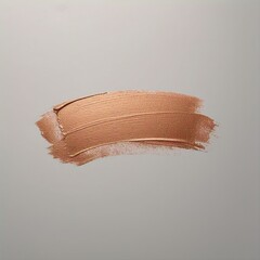 Aesthetic shot of a curved bronze paint stroke on a light gray background creating a simple design