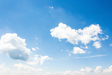sky with fluffy clouds. azure peaceful softness.white cumulus cloudscape on a blue gradient of atmosphere. sunny summer weather. scenic nature background. meteorology backdrop. fresh air
