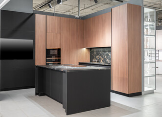 modern huge built-in kitchen with upper and lower cabinets, shelves, drawers. wooden and gray...