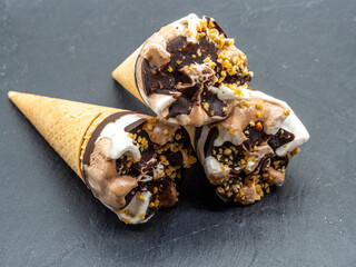 mini ice cream cones arranged on slate