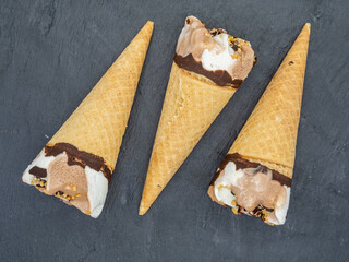 mini ice cream cones arranged on slate