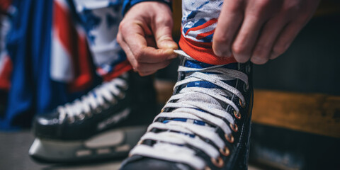 Hockey player tying skate laces in locker room, preparing for game