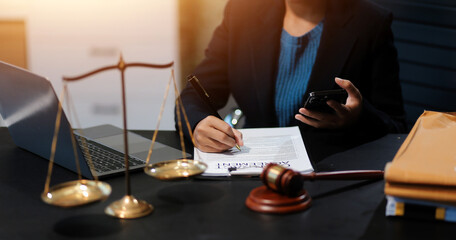 female business woman lawyers working at the law firms. Judge gavel with scales of justice. Legal...