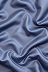 Fototapeta premium Soft elegant smooth silk fabric with gentle folds and shiny surface in a calming blue color for luxury fashion textile and interior design backgrounds