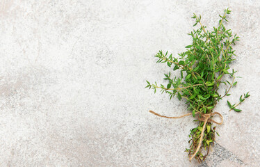 Fresh thyme herbs on rustic surface