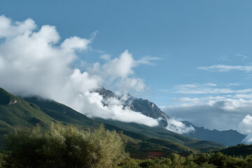 breathtaking view of mountain krit with majestic clouds enveloping its peak