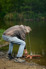 Senior citizen fishing with magnet in city lake found guns