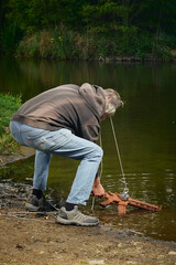 Senior citizen fishing with magnet in city lake found guns
