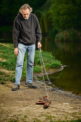 Senior citizen fishing with magnet in city lake found guns