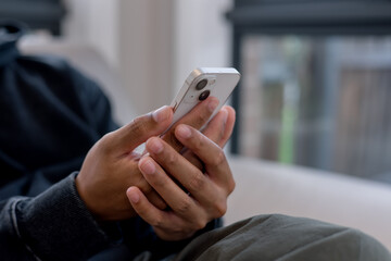 Social media and digital online concept, man using smart phone. The concept of living on vacation and playing social media. Social Distancing ,Working From Home